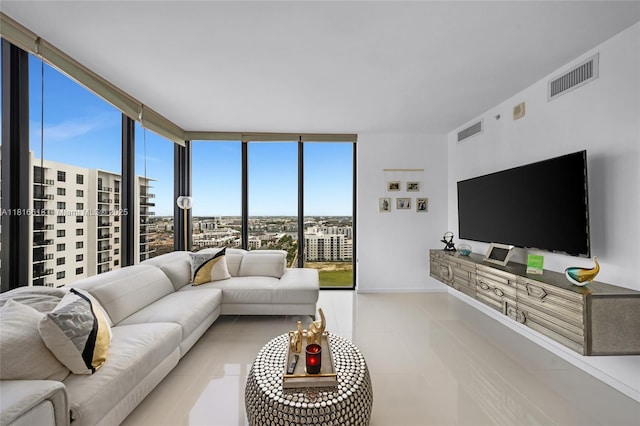5252 NW 85th Ave Unit 1701, Doral, FL 33166 - living area featuring a wall of windows, tile patterned floors, and baseboards