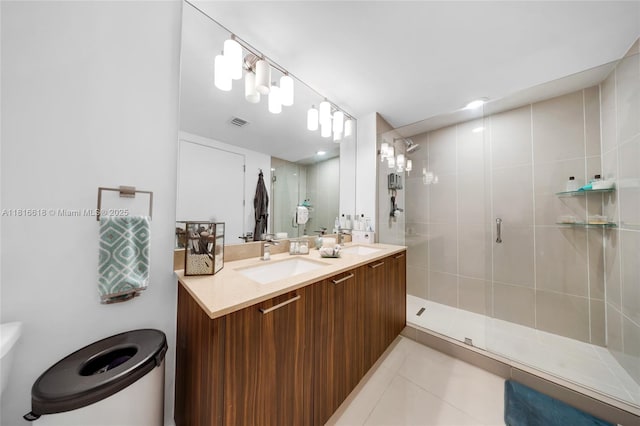 5252 NW 85th Ave Unit 1701, Doral, FL 33166 - bathroom with double vanity, a shower stall, tile patterned flooring, and toilet