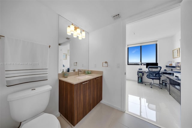 5252 NW 85th Ave Unit 1701, Doral, FL 33166 - bathroom featuring tile patterned floors, toilet, vanity, and baseboards