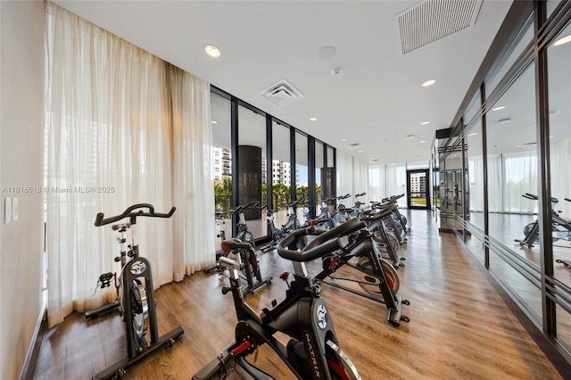 5252 NW 85th Ave Unit 1701, Doral, FL 33166 - gym featuring floor to ceiling windows, french doors, wood finished floors, and recessed lighting