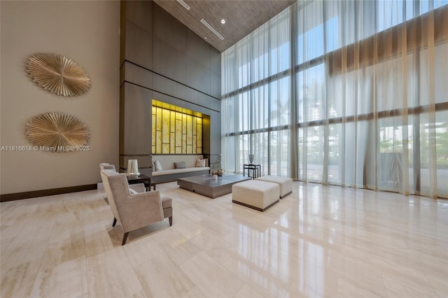 5252 NW 85th Ave Unit 1701, Doral, FL 33166 - community lobby featuring a towering ceiling and floor to ceiling windows