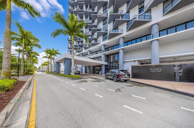 5252 NW 85th Ave Unit 1701, Doral, FL 33166 - view of asphalt street with curbs, sidewalks, and street lights