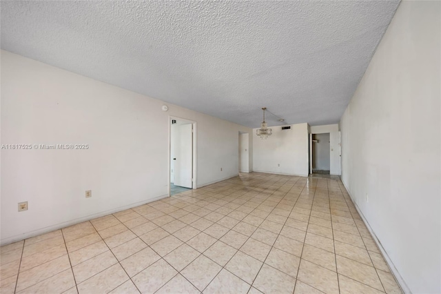 7921 Byron Ave Unit 407, Miami Beach, FL 33141 - unfurnished room with a textured ceiling and a chandelier