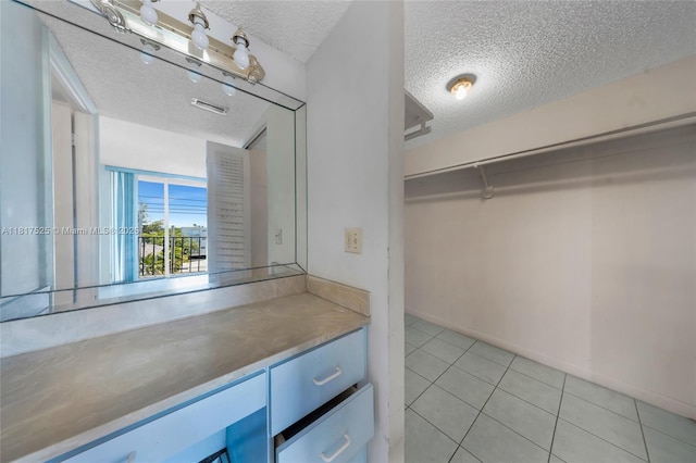 7921 Byron Ave Unit 407, Miami Beach, FL 33141 - walk in closet with light tile patterned flooring