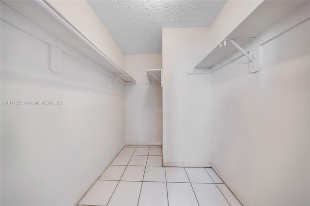 7921 Byron Ave Unit 407, Miami Beach, FL 33141 - spacious closet featuring light tile patterned floors