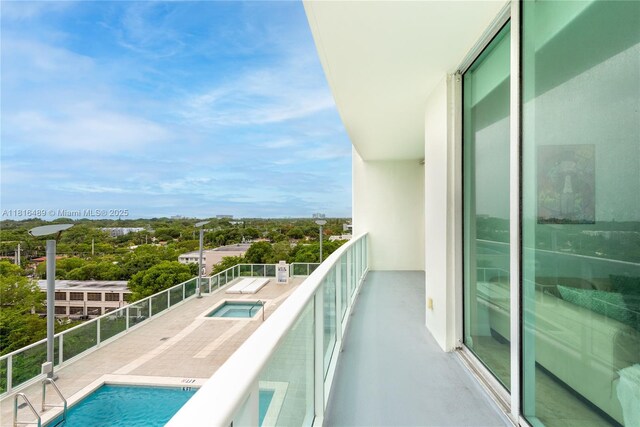 2525 SW 3rd Ave Unit 711, Miami, FL 33129 - balcony featuring view of pool and view of wooded area