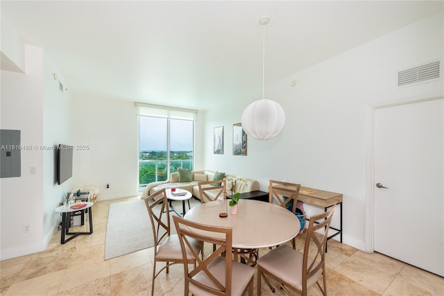 2525 SW 3rd Ave Unit 711, Miami, FL 33129 - dining room featuring electric panel and baseboards