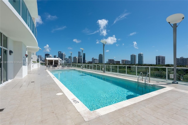 2525 SW 3rd Ave Unit 711, Miami, FL 33129 - community pool featuring a skyline view and a patio area