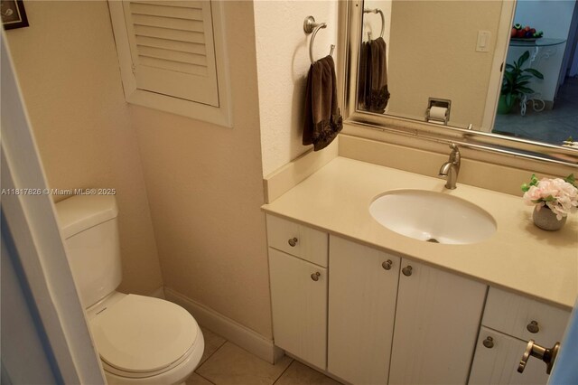 9820 S Hollybrook Lake Dr Unit 106, Pembroke Pines, FL 33025 - half bathroom with vanity, toilet, and tile patterned floors