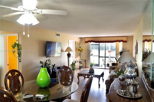 9820 S Hollybrook Lake Dr Unit 106, Pembroke Pines, FL 33025 - dining area with ceiling fan, tile patterned flooring, and a textured ceiling