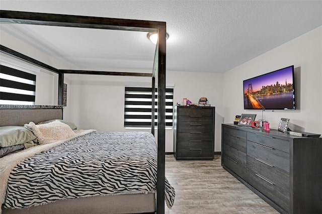30930 SW 190th Ave, Homestead, FL 33030 - bedroom with light wood finished floors and a textured ceiling