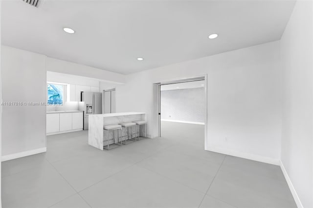 9401 SW 78th St, Miami, FL 33173 - spare room featuring light tile patterned flooring and recessed lighting