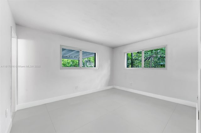 9401 SW 78th St, Miami, FL 33173 - empty room featuring baseboards and tile patterned floors