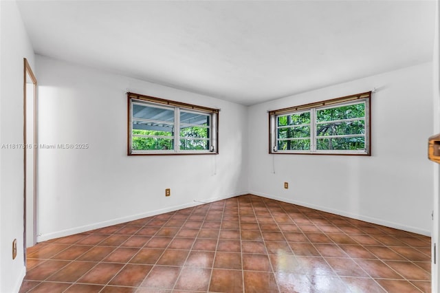 9401 SW 78th St, Miami, FL 33173 - unfurnished room featuring dark tile patterned floors and baseboards