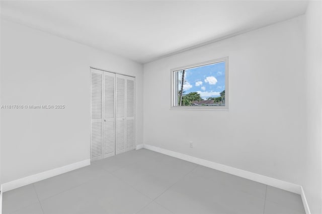9401 SW 78th St, Miami, FL 33173 - unfurnished bedroom featuring a closet and tile patterned flooring
