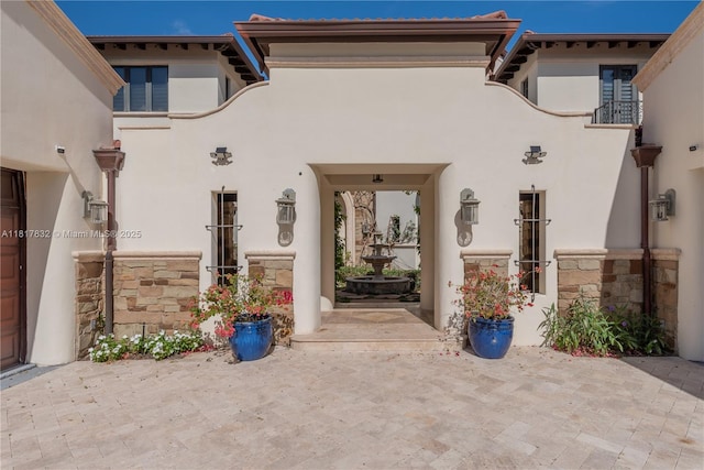 9801 SW 60th Ct, Pinecrest, FL 33156 - doorway to property featuring stucco siding and stone siding