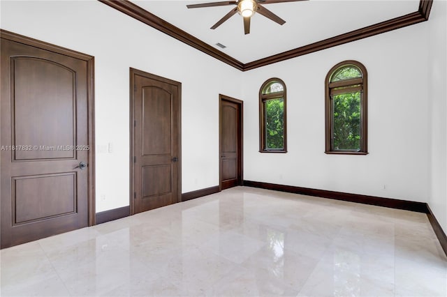 9801 SW 60th Ct, Pinecrest, FL 33156 - spare room with ceiling fan, ornamental molding, baseboards, and marble tiled floors