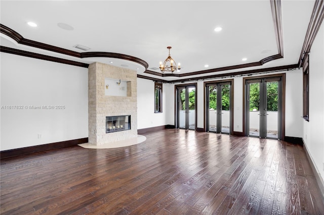 9801 SW 60th Ct, Pinecrest, FL 33156 - unfurnished living room with ornamental molding, a fireplace, hardwood / wood-style floors, baseboards, and a chandelier