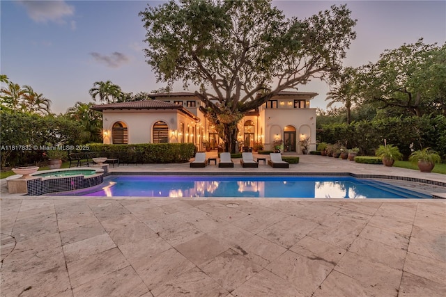 9801 SW 60th Ct, Pinecrest, FL 33156 - view of pool with a patio area and a pool with connected hot tub