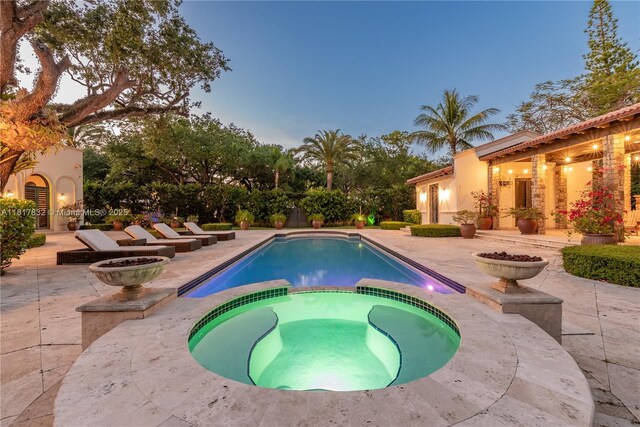 9801 SW 60th Ct, Pinecrest, FL 33156 - view of swimming pool featuring a patio and a pool with connected hot tub