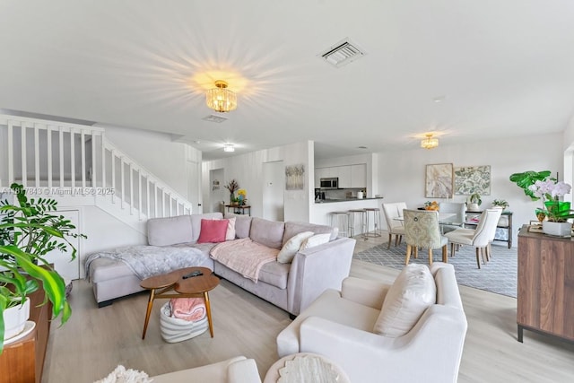 11045 SW 16th Mnr, Davie, FL 33324 - living area with light wood finished floors and stairway