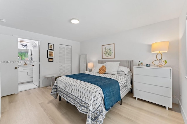 11045 SW 16th Mnr, Davie, FL 33324 - bedroom with light wood-style floors, ensuite bathroom, and a closet