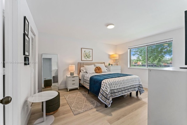 11045 SW 16th Mnr, Davie, FL 33324 - bedroom featuring baseboards and light wood finished floors