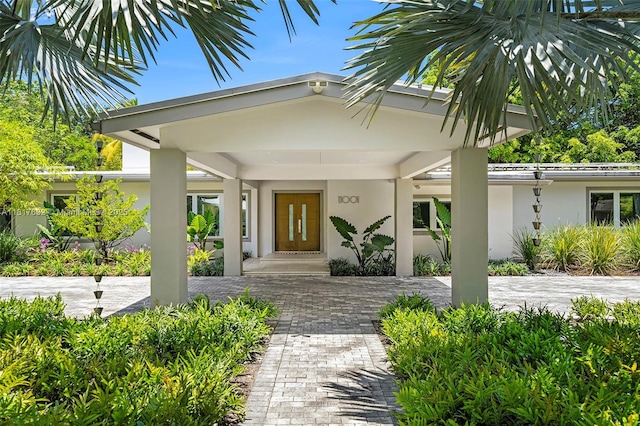 11001 SW 64th Ave, Pinecrest, FL 33156 - property entrance featuring stucco siding and decorative driveway