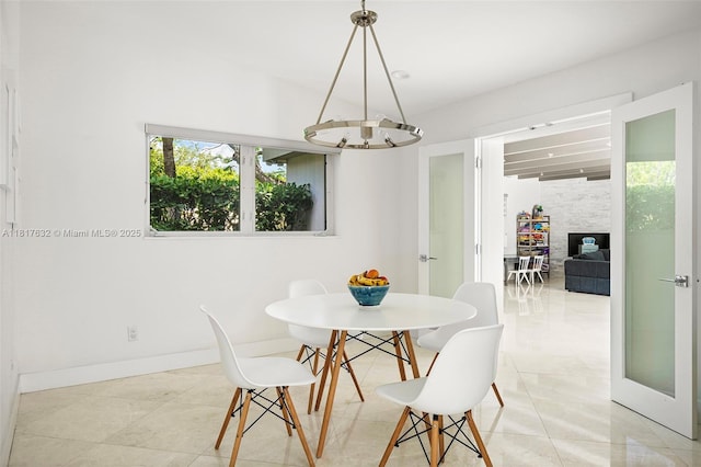 11001 SW 64th Ave, Pinecrest, FL 33156 - dining space with light tile patterned flooring and baseboards