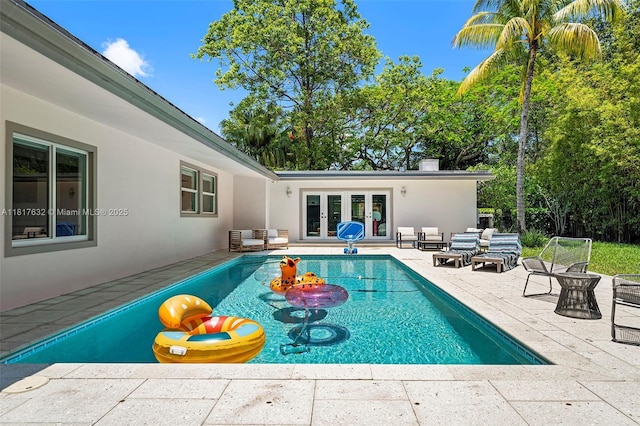 11001 SW 64th Ave, Pinecrest, FL 33156 - outdoor pool featuring french doors, a patio area, and outdoor lounge area