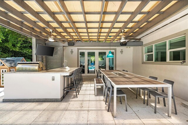 11001 SW 64th Ave, Pinecrest, FL 33156 - view of patio with ceiling fan, a pergola, and an outdoor kitchen