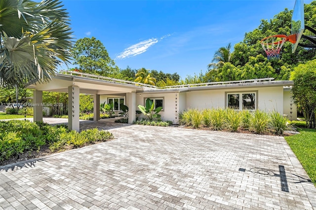 11001 SW 64th Ave, Pinecrest, FL 33156 - view of front of home featuring stucco siding and decorative driveway