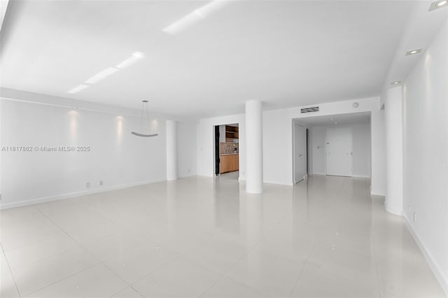 900 Bay Dr Unit 904, Miami Beach, FL 33141 - empty room with baseboards and light tile patterned floors