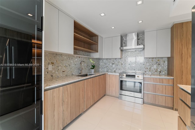 900 Bay Dr Unit 904, Miami Beach, FL 33141 - kitchen with stainless steel electric range, wall chimney range hood, open shelves, a sink, and light stone counters