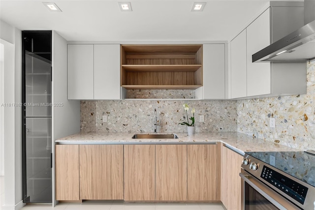 900 Bay Dr Unit 904, Miami Beach, FL 33141 - kitchen featuring open shelves, electric range, a sink, light stone counters, and wall chimney range hood