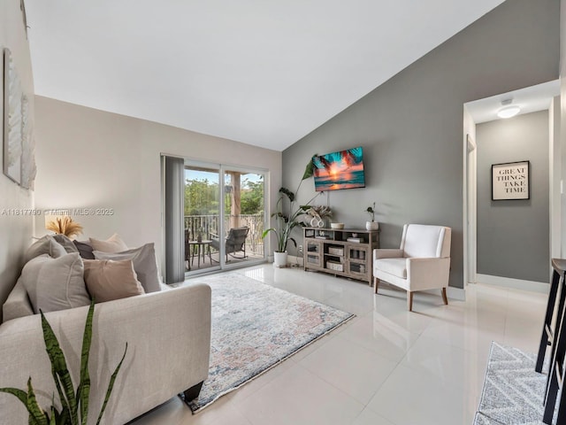10421 SW 157th Pl Unit 301, Miami, FL 33196 - tiled living room featuring lofted ceiling and baseboards