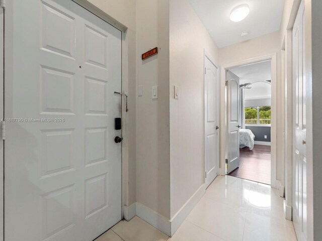 10421 SW 157th Pl Unit 301, Miami, FL 33196 - foyer entrance featuring baseboards and light tile patterned floors
