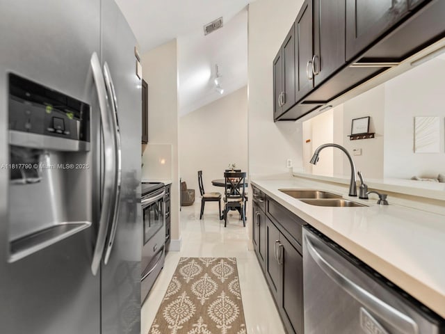 10421 SW 157th Pl Unit 301, Miami, FL 33196 - kitchen with stainless steel appliances, a sink, light countertops, light tile patterned flooring, and rail lighting