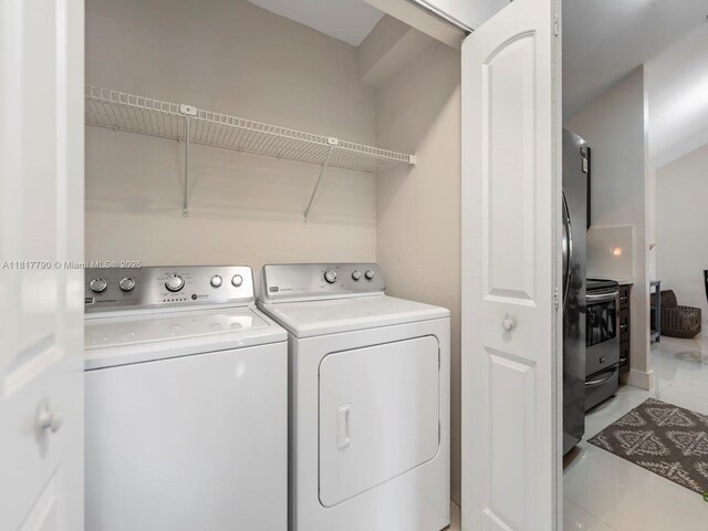 10421 SW 157th Pl Unit 301, Miami, FL 33196 - laundry room featuring washer and dryer and tile patterned flooring