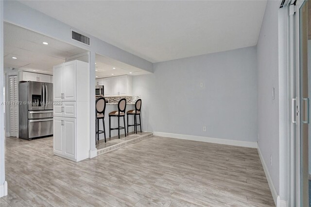 1449 NW 122nd Ter, Pembroke Pines, FL 33026 - empty room with light wood-style floors and recessed lighting