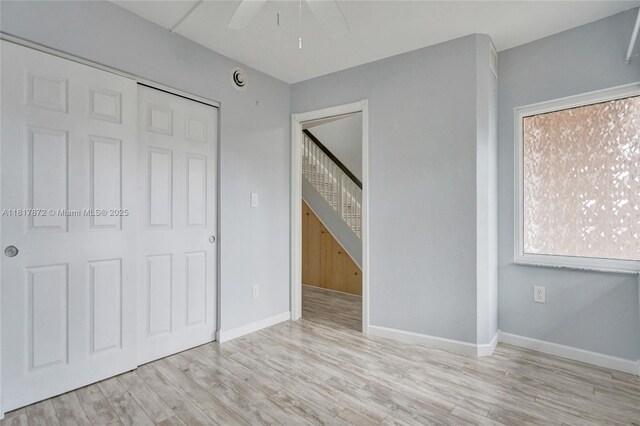 1449 NW 122nd Ter, Pembroke Pines, FL 33026 - unfurnished bedroom with wood finished floors, a closet, and ceiling fan