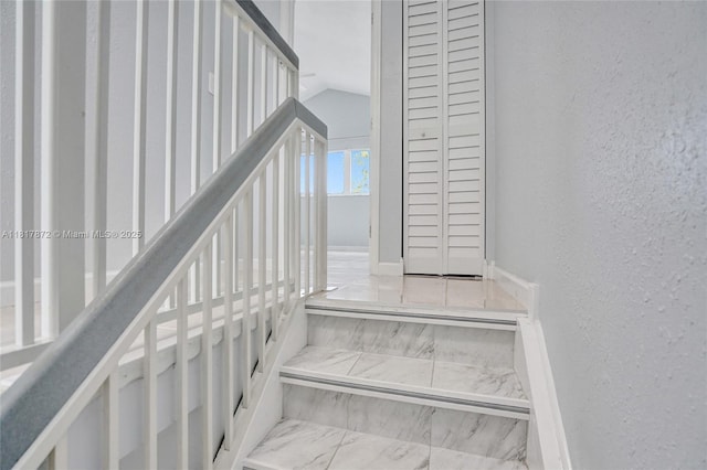 1449 NW 122nd Ter, Pembroke Pines, FL 33026 - stairs with a textured wall and marble finish flooring