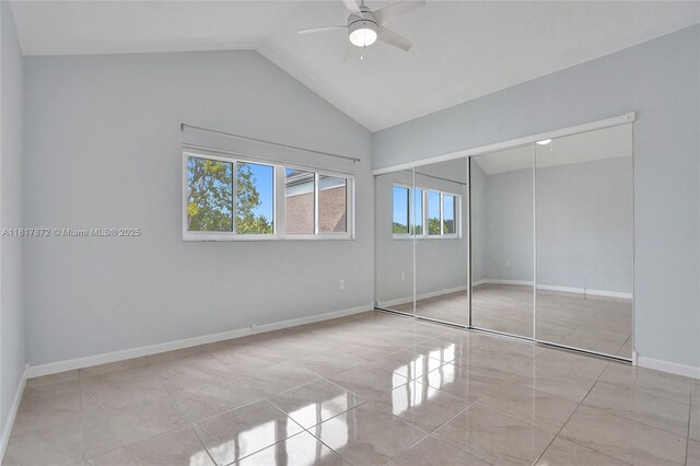 1449 NW 122nd Ter, Pembroke Pines, FL 33026 - unfurnished bedroom with vaulted ceiling, a closet, a ceiling fan, and tile patterned flooring