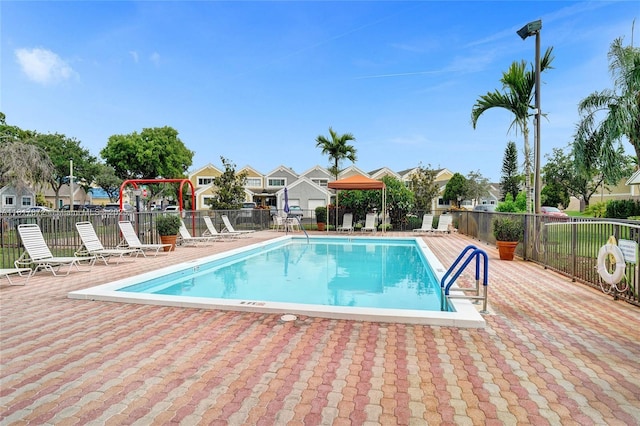 1449 NW 122nd Ter, Pembroke Pines, FL 33026 - community pool with a gazebo, a residential view, and a patio area