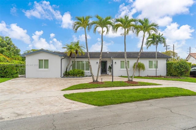 10223 SW 17th St, Miami, FL 33165 - ranch-style home with driveway, stucco siding, and a front lawn