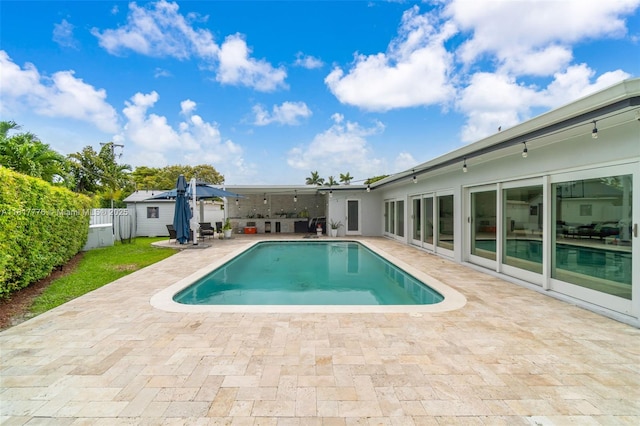 10223 SW 17th St, Miami, FL 33165 - view of swimming pool featuring a patio and a fenced backyard