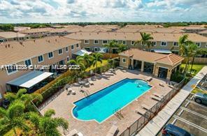 1041 SE 23rd Ter, Homestead, FL 33035 - community pool with a patio