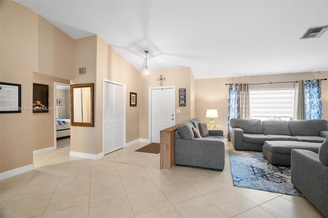13317 NW 8th Ct, Sunrise, FL 33325 - living area featuring vaulted ceiling, baseboards, and light tile patterned flooring