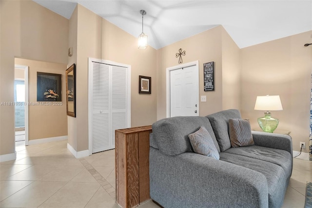 13317 NW 8th Ct, Sunrise, FL 33325 - living area featuring light tile patterned floors, baseboards, and high vaulted ceiling