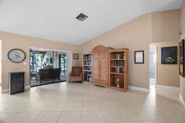 13317 NW 8th Ct, Sunrise, FL 33325 - living area featuring high vaulted ceiling, light tile patterned floors, and baseboards